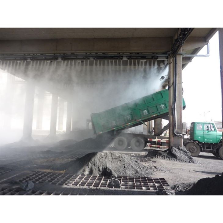 Open truck at a dusty bulk material transfer point